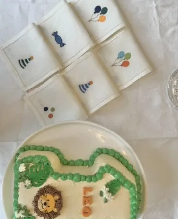 The celebration napkins beside a birthday cake